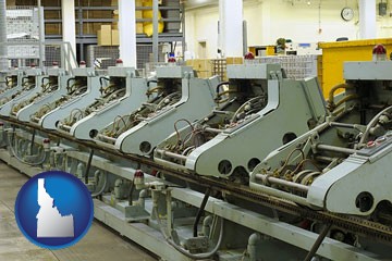 bindery machines in a bookbinding factory - with Idaho icon